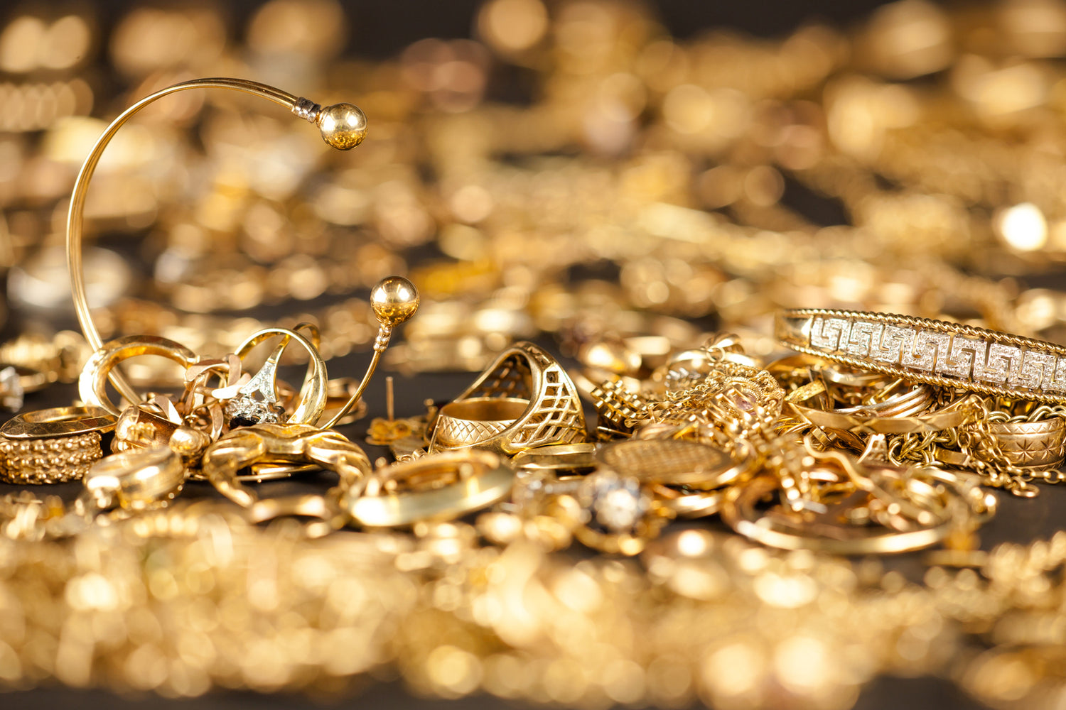 Gold jewelry and coins ready for sale at L&V Jewelry in Waltham MA