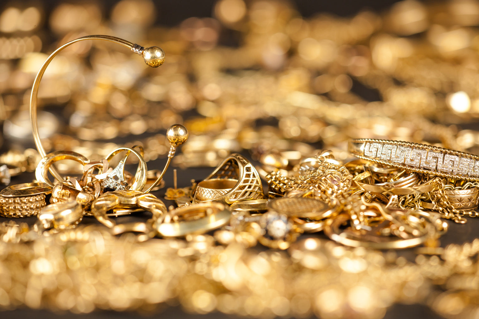 Gold jewelry and coins ready for sale at L&V Jewelry in Waltham MA